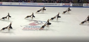 image of synchronized death spirals from the 2017 World Synchronized Skating Championships